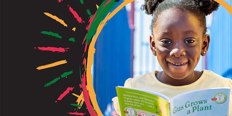 A girl enjoys a picture book.